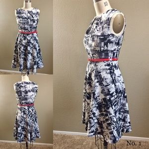 Black and white fit and flare with red belt